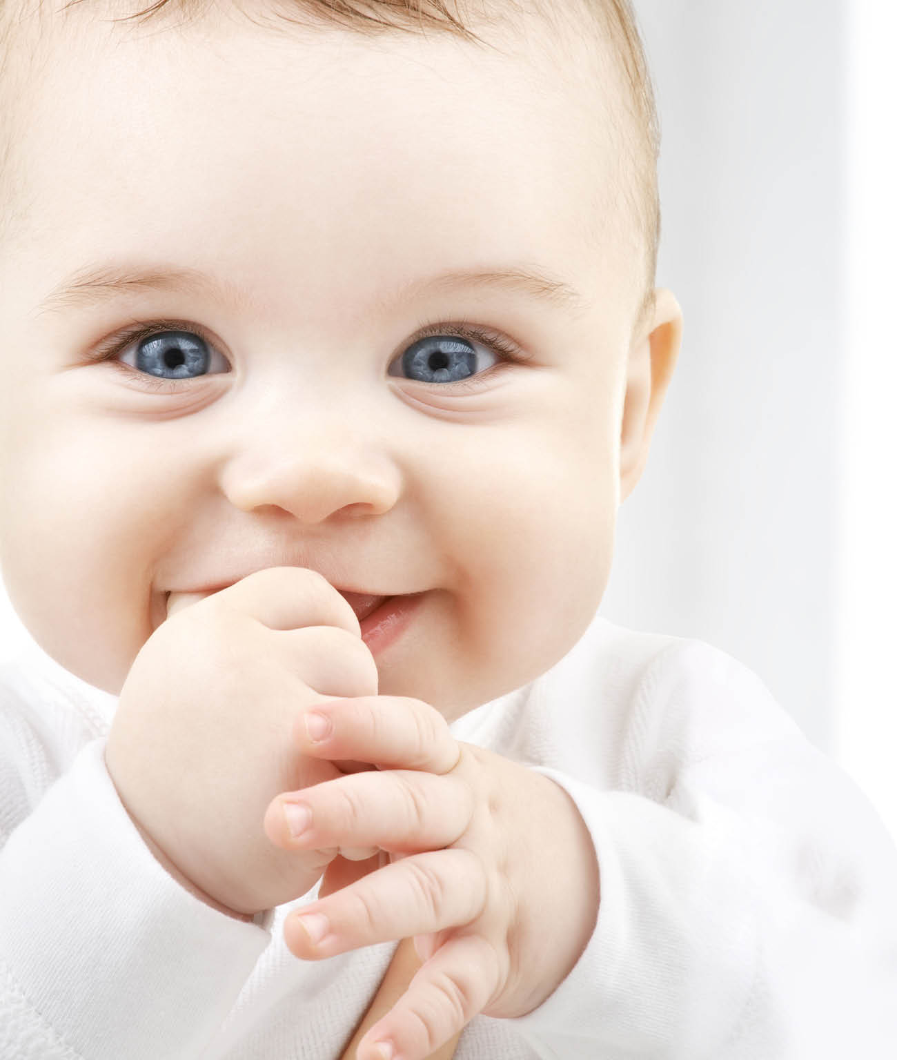 child, happiness and people concept - adorable baby